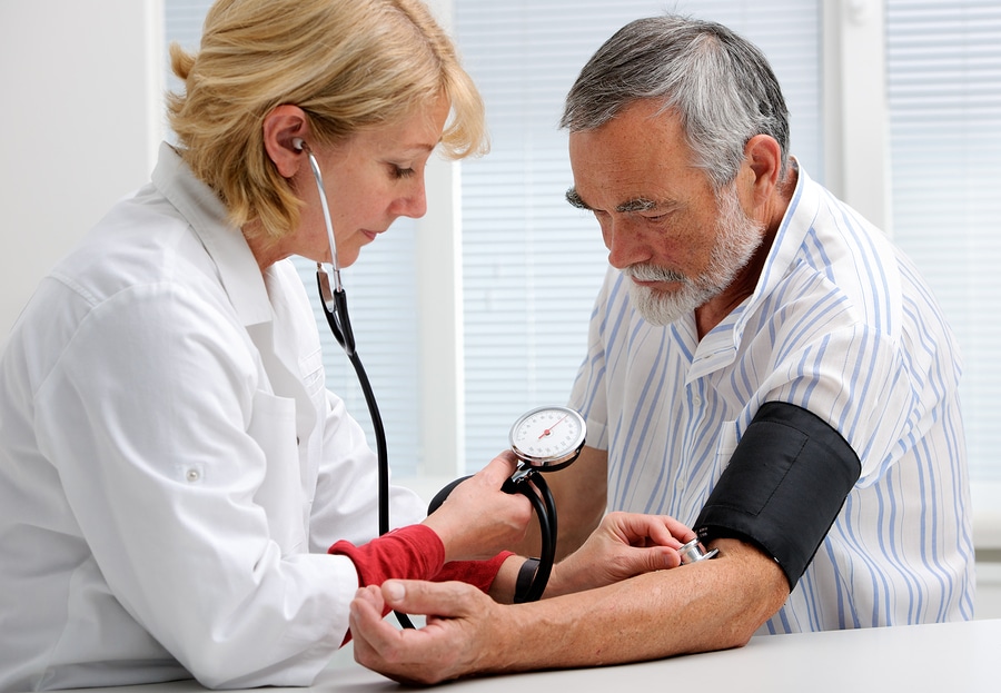 Home health aides can help monitor aging seniors' blood pressure.